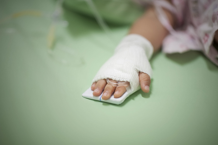 One child must get saline solution to kill the germs in the stomach.の写真素材