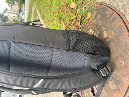 Black bag on the ground in the garden. Selective focus.