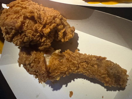 Fried chicken on a white plate, closeup of photo.の写真素材