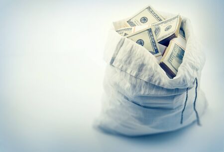Sack full of money dollar currency, shallow depth of fieldの写真素材