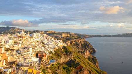 beautiful caldera view of  Greek houses built on Cliff at Fira when sunset, the capital of Santoriniの写真素材
