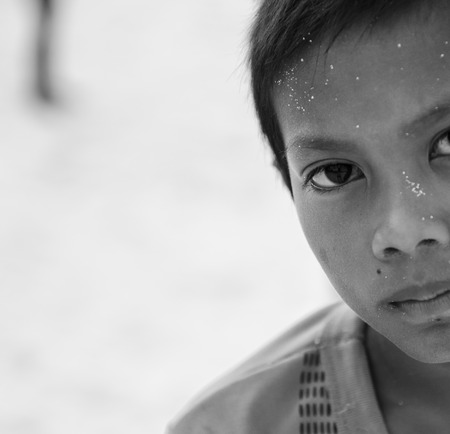Semporna, Maylaysia - Sep 29, 2013  A Bajau kid staring at camra, shot on Mabul island, Semporna, Sabah, Maylaysia  Bajau people are also referenced as the last sea gypsies,  sea-oriented, boat-dwelling, nomadic, and no country のeditorial素材