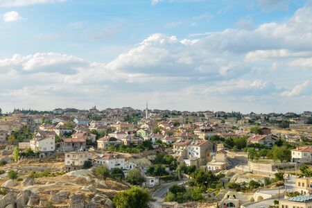 Monumental ancient Ortahisar castle under blue sky in Cappadocia, Turkeyの写真素材