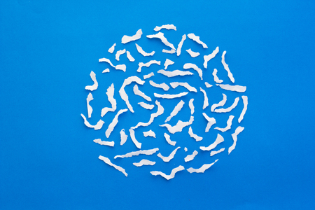 white paper torn on blue paper backgroundの写真素材