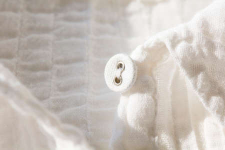 button on white shirt selective focus with shallow depth of fieldの写真素材