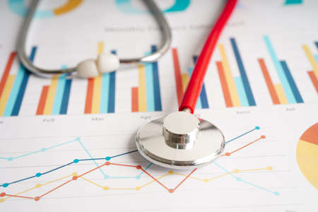 Stethoscope on charts and graphs spreadsheet paper, Finance, Account, Statistics, Investment,...