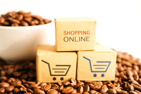 Shopping cart box on coffee beans, shopping online for export or import.