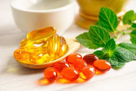 Alternative medicine herbal organic capsule with vitamin E omega 3 fish oil, mineral, drug with herbs leaf natural supplements for healthy good life.の写真素材