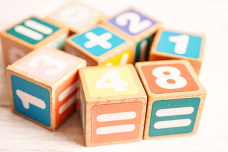 Number wood block cubes for learning Mathematic, education math concept.の写真素材