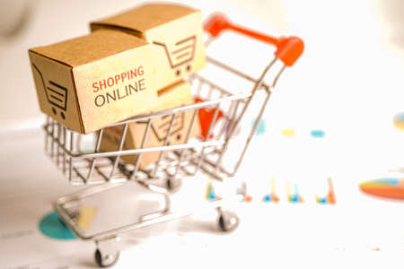 Online shopping, Shopping cart box on business graph, import export, finance commerce.の写真素材