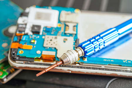 Repairing and upgrade mobile phone, electronic, computer hardware and technology concept.の写真素材