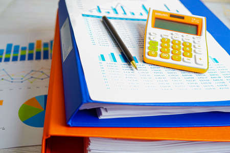 Stack of binder file folder on table in business modern office.
on wooden desk in large modern officeの写真素材