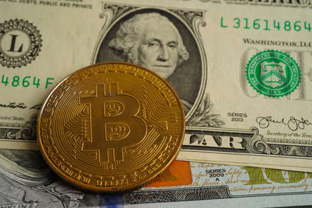 Golden bitcoin on US dollar banknotes money for business and commercial, Digital currency, Virtual cryptocurrency, blockchain technology.の写真素材