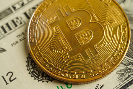 Golden bitcoin on US dollar banknotes money for business and commercial, Digital currency, Virtual cryptocurrency, blockchain technology.の写真素材