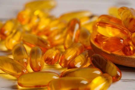 Fish oil or Cod liver oil gel in capsules with omega 3 vitamins, supplementary healthy food