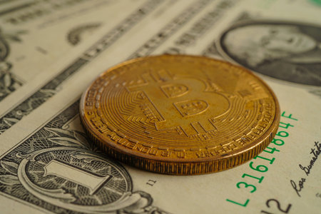 Golden bitcoin on US dollar banknotes money for business and commercial, Digital currency, Virtual cryptocurrency, blockchain technology.の写真素材