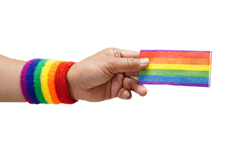 Asian woman holding rainbow flag isolated on white background with clipping path, LGBT symbol rights and gender equality, LGBT Pride Month in June.の写真素材