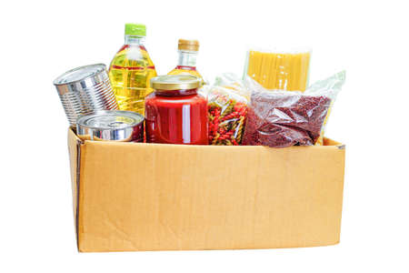 Foodstuffs in donation box for volunteer isolated on white backgroundの写真素材