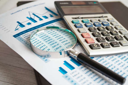Calculator on chart and graph spreadsheet paper. Finance development, Banking Account, Statistics, Investment Analytic research data economy, Stock exchange trading, Business company concept.の写真素材