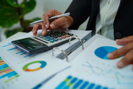 Businessman working and analysis with statistic graph in office.の写真素材