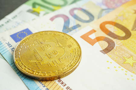 Golden bitcoin on Euro banknotes money for business and commercial, Digital currency, Virtual cryptocurrency.の写真素材