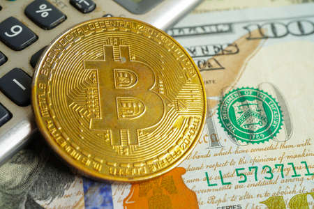 Golden bitcoin on US dollar banknotes money for business and commercial, Digital currency, Virtual cryptocurrency, blockchain technology.の写真素材