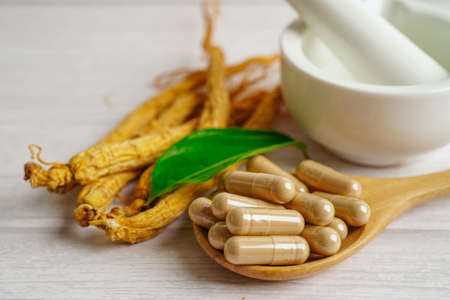 Ginseng roots and green leaf, healthy food.の写真素材