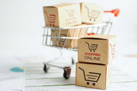 Online shopping, Shopping cart box on business graph, import export, finance commerce.