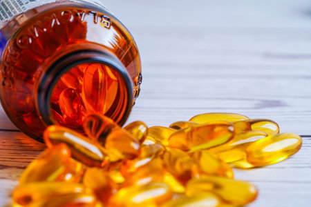 Bangkok, Thailand - April 27, 2022 Fish oil or Cod liver oil gel in capsules with omega 3 vitamins, supplementary healthy foodのeditorial素材