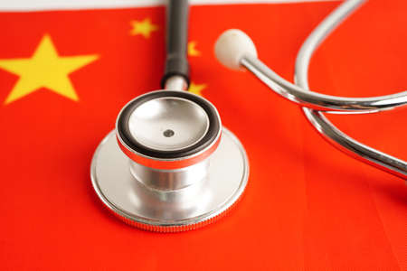 Black stethoscope on China flag background, Business and finance concept.の写真素材
