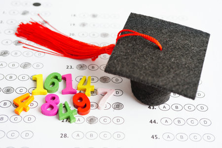 Math number with graduation gap hat on answer sheet test choice for learning Mathematic, education math concept.の写真素材