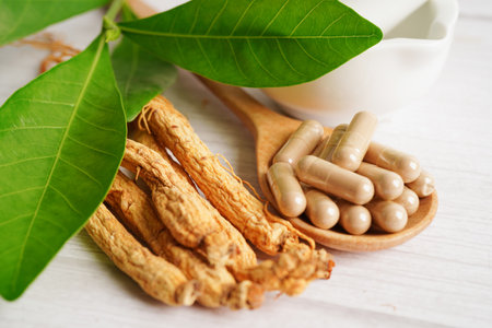 Ginseng roots and green leaf, healthy food.の写真素材