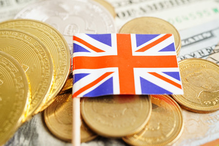 Stack of coins money with United kingdom flag, finance banking conceptの写真素材