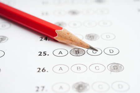 Answer sheets with pencil drawing fill to select choice, education concept.