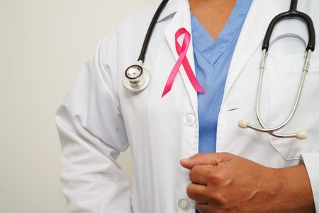 Asian woman doctor with pink ribbon, World Breast Cancer Day at October.の写真素材