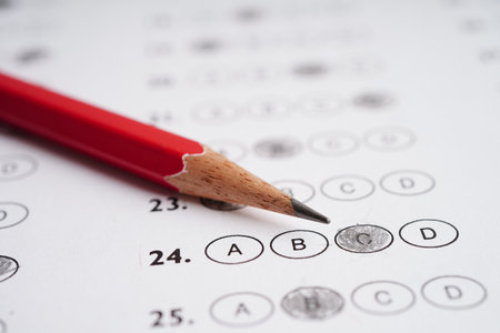 Answer sheets with pencil drawing fill to select choice, education concept.の写真素材