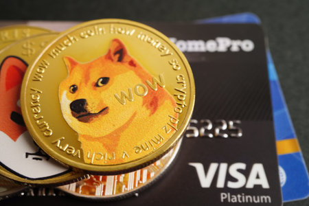 Bangkok, Thailand - December 15, 2021 Golden bitcoin with credit card on US dollar banknotes money for business and commercial, Digital currency, Virtual cryptocurrency.のeditorial素材