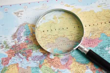 Bangkok, Thailand - May 15, 2022 Magnifying glass on world map.のeditorial素材