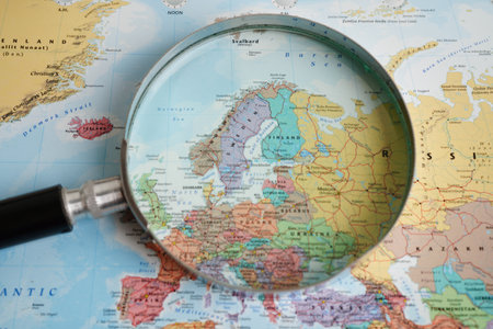 Bangkok, Thailand - May 15, 2022 Magnifying glass on world map.のeditorial素材