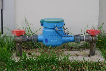 Bangkok, Thailand - May 15, 2022 Water meter with pipe and brass valve sealed connection  install to count measuring for payment monthly bill at home.のeditorial素材