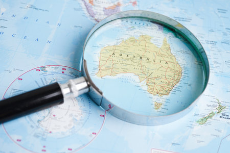 Bangkok, Thailand - May 15, 2022 Magnifying glass on world map.のeditorial素材