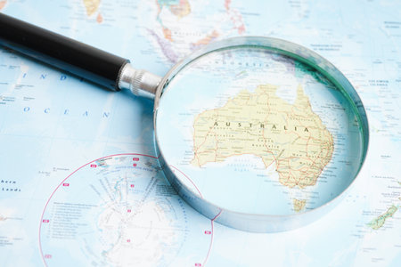 Bangkok, Thailand - May 15, 2022 Magnifying glass on world map.のeditorial素材