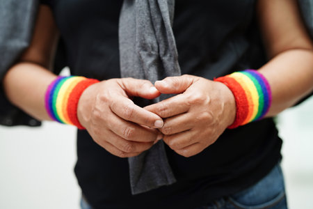 Asian woman with rainbow flag, LGBT symbol rights and gender equality, LGBT Pride Month in June.の写真素材