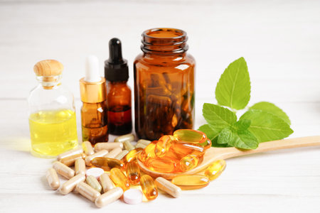 Alternative medicine herbal organic capsule with vitamin E omega 3 fish oil, mineral, drug with herbs leaf natural supplements for healthy good life.の写真素材