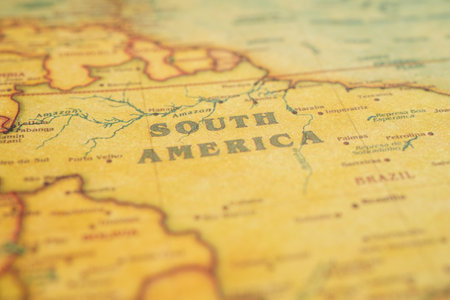 Bangkok, Thailand - December 15, 2021 Magnifying glass on ancient vintage world map.のeditorial素材