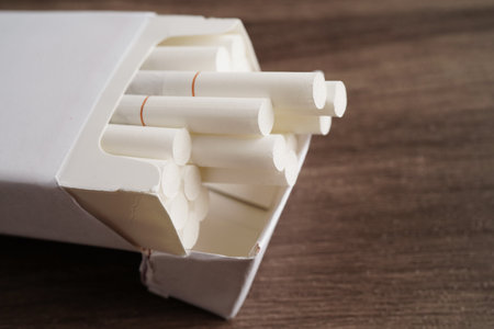 Cigarette in pack, roll tobacco in paper with filter tube, No smoking concept.