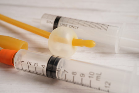 Foley catheter and urine drainage bag collect urine for disability or patient in hospital.の写真素材