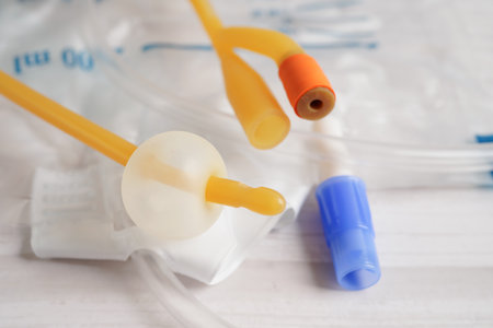 Foley catheter and urine drainage bag collect urine for disability or patient in hospital.の写真素材