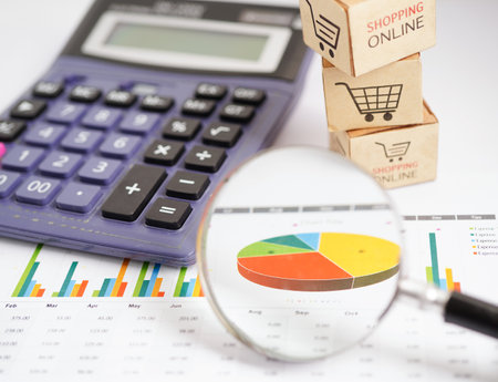 Online shopping, Shopping cart box on business graph, import export, finance commerce.の写真素材