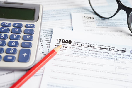 Tax form 1040 U.S. Individual Income Tax Return, business finance concept.の写真素材